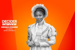 Deborah Ayorinde in black and white on a bright orange background