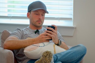 Jeramey looking at his phone